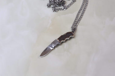 https://japaneseknifedirect.com/cdn/shop/products/fumio-inagaki-fi-10-miniature-necklace-knife-17347712876589_380x.jpg?v=1599593072